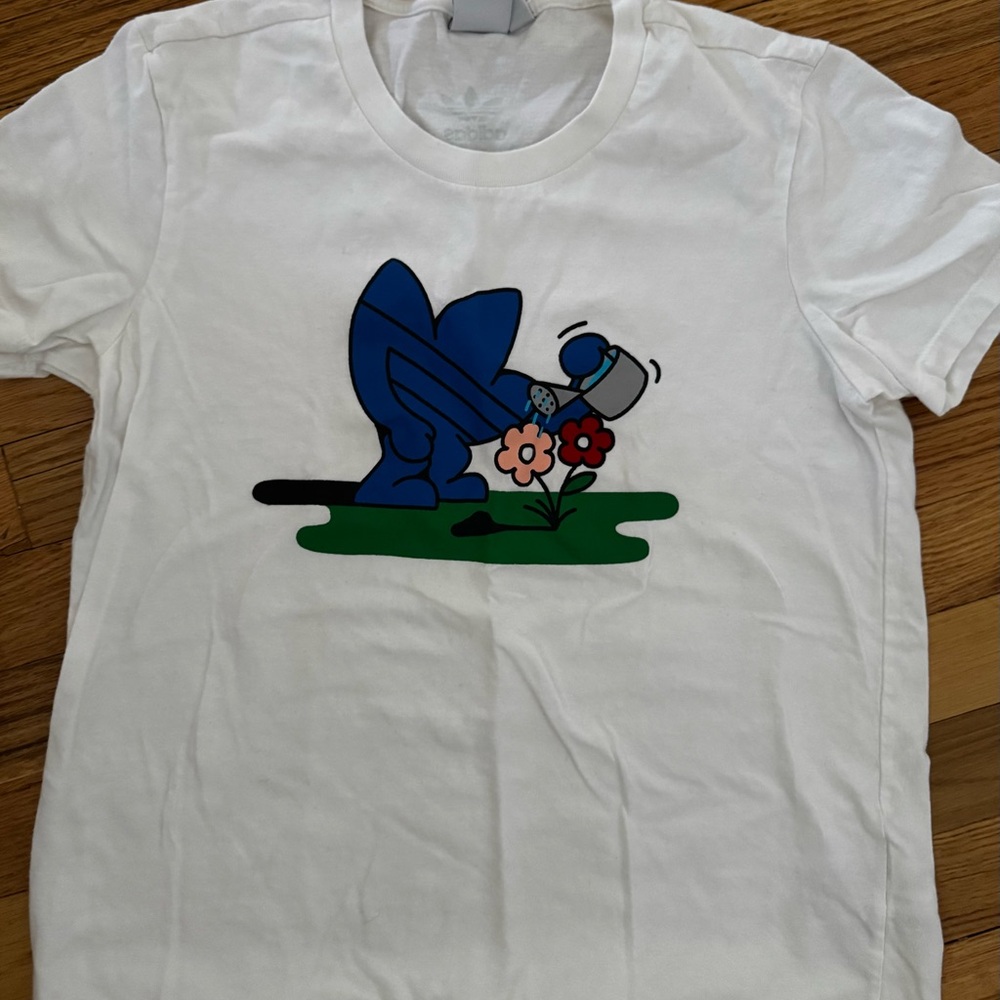 adidas White Tee with Blue Watering Can Cartoon